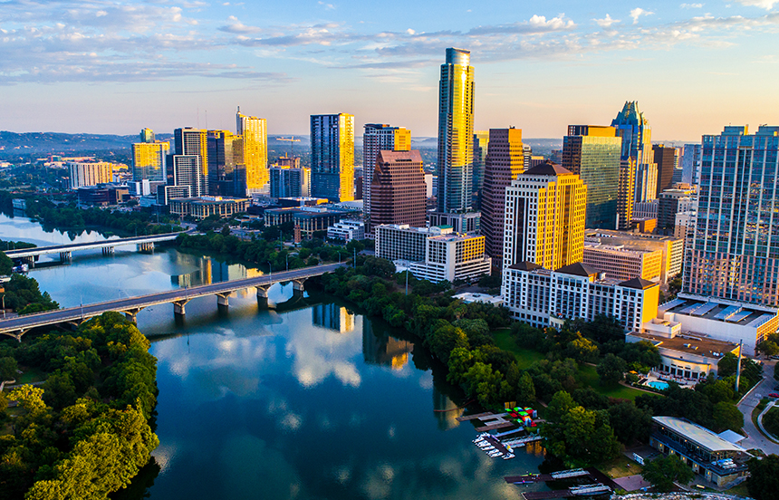 Austin cityscape with high-rise buildings and blue sky.